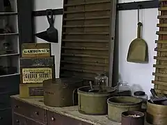 Shaker seed room showing preparation for fill measuring of envelope "papers"