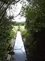 Canalised channel of the Tame. Sluices feeding the Sheepwash lakes are visible on both sides.