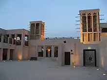 Image 1Sheikh Maktoum house courtyard featuring the common architecture of wind-catchers called Barjeel. (from Culture of the United Arab Emirates)