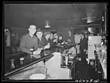 Dick's images of Pennsylvania mining towns, including this one of a bar in Gilberton (also dated "1938?"), focus on everyday activities, household living and items, and the mines themselves.