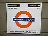 Platform roundel, based on the famous symbol of London Transport, but with Overground orange circle