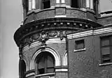 Bas-relief on cornice of tower