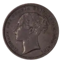 A British shilling, featuring Queen Victoria.