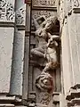 Salabhanjika style statues adoring the outside wall of the temple.