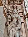 Salabhanjika style statues adoring the outside wall of the temple.