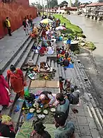 People performing shraddha on the banks of Bagmati river near Pashupatinath temple, Nepal