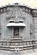 Shrine wall relief, molding frieze and miniature decorative tower in Mallikarjuna Temple at Kuruvatti.