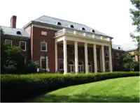 Building with central cupola and wings with Greek-style columns