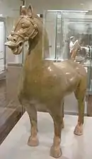 An Eastern Han glazed ceramic statue of a horse with halter and bridle headgear, late 2nd century or early 3rd century AD