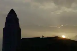 The silhouette of City Hall at sunrise.