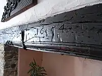 Simonsbath House, Simonsbath, Exmoor Parish, Devon. Wooden lintel over kitchen fireplace with carved date of 1654