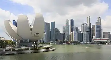 A lotus-inspired building designed by Moshie Safdie that features 10 “fingers” anchored by a unique round base in the middle.