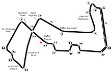 Track layout of the Marina Bay Street Circuit. The track has 23 corners, which range in sharpness from hairpins to gentle, sweeping turns. There are four long straights which link the corners together. The pit lane splits off from the track on the inside of Turn 22, and rejoins the track after the exit of turn one.