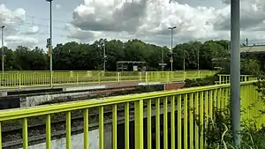 Side platforms surrounding double-tracked railway line