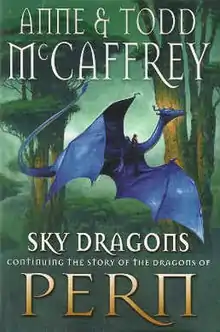 Book dust jacket showing a blue dragon, with its much smaller rider straddling the base of its neck, flying past the trunks of two large trees