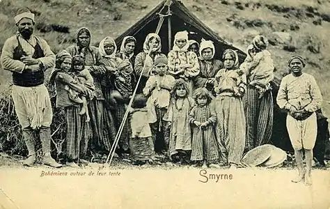 Postcard of a Muslim Romani Men with his 8 Wives and 10 Children, in front of their tent in Smyrne (today the city of Izmir) in 1903.