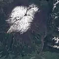 Snow-capped Llaima in springtime seen from space