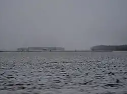 Snow-covered fields and woods in western Greene Township