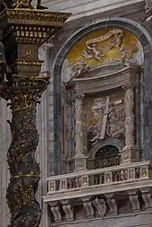 At right, two of the Solomonic columns brought to Rome by Constantine, in their present-day location on a pier in St. Peter's Basilica (Rome). In the foreground at left is part of Bernini's Baldachin, inspired by the original columns.