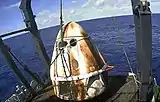 SpaceX’s Crew Dragon Demo-1 spacecraft aboard the company's recovery vessel, GO Searcher, following splashdown at 8:45 a.m. EST on March 8, 2019.