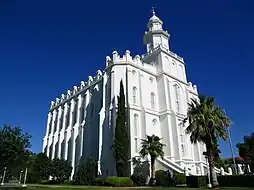 The St. George Temple from a distance looking up at the southeast corner, showing battlements and parapets, and the cupola. Taken before undergoing the 2019-2023 renovations, taken in 2006.