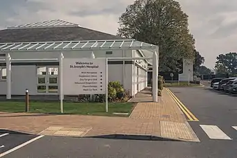 This image shows an orientational panel outside the hospital, directing patients and visitors to various departments.