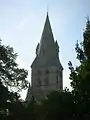 View of St Philip and St James Church, designed by G. E. Street, from the north end of Winchester Road.