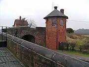 Toll House and upper bridge at the Bratch Locks.