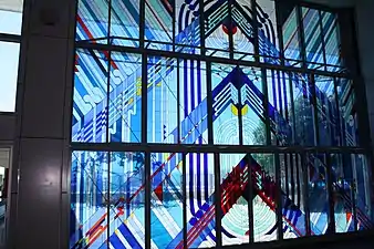 detail of the stained glass door, depicting Ranginui (the sky father). When opened, "it pushes upwards away from the flooring (which depicts Papatūānuku, the earth mother), re-enacting the traditional Māori story of [their] separation."