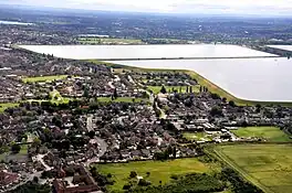 Two large reservoirs surrounded by flat land and housing