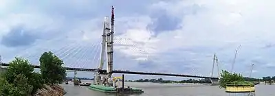 Panorama the unfinished bridge spanning the river with all cable stays in place.