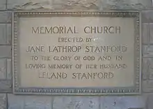 Rectangular dedication plaque, which states, "Memorial Church erected by Jane Lathrop Stanford to the glory of God and in loving memory of her husband Leland Stanford"