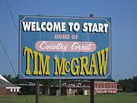 Welcome sign notes that McGraw once resided there