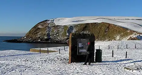 St Bees: Start of the C to C in winter (The "Wainwright wall" in foreground)