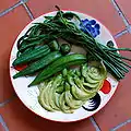 Steamed Sesbania grandiflora flowers (bottom), among other vegetables, in a Thai dish