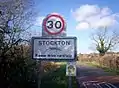 The sign on the road from Napton; note the image of an ichthyosaurus