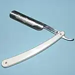 A DOVO straight razor.