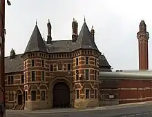 The French Gothic gatehouse of Strangeways Prison by Alfred Waterhouse.