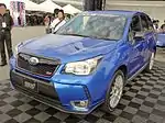 Subaru Forester STI tS, a higher-performance variant of the Subaru Forester. This photo shows the front of the car, which is blue with a small "STI" emblem on the front grille.