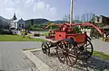 Square with a church and a historical fire truck