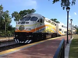 A southbound SunRail train departs the new Winter Park station on its way to Florida Hospital.