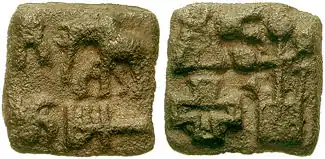 A Sunga coin (150 BCE-100 CE) with three-arched hill (reverse, top left) among other symbols.