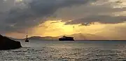 Sunset near Yung Shue Wan. The Central–Yung Shue Wan ferry (from Hong Kong Island to Lamma Island) is visible; Cheung Chau and Lantau Island are in the background.