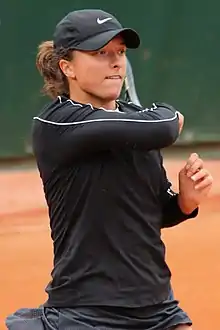 Image 37Iga Świątek, the 2023 women's singles champion. It was her fourth major title and her third at the French Open. (from French Open)