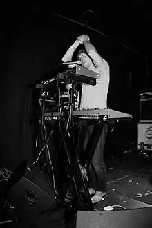 Tofte of Swimming With Dolphins performing live in 2009