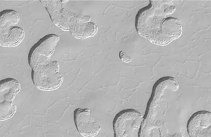 Close-up view of Swiss cheese terrain.  Polygonal pattern was probably formed by shallow troughs.