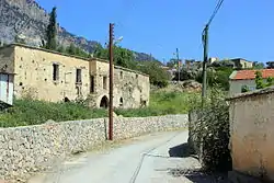 Main street and ruins in Sysklipos