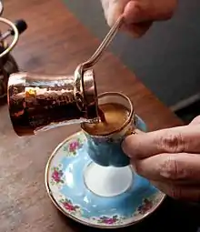 A cup of Turkish coffee, served from a copper cezve, in Turkey