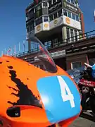 Parc Fermé – Competitors and machines wait for the start of the first evening practice session. TT Grandstand Saturday 18 August 2012