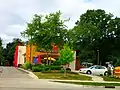 Taco John's with a tree-garden in front;, Monona, WI